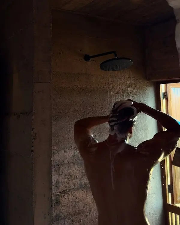 Man in shower with intention