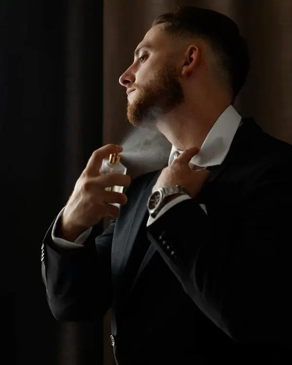 Man applying cologne