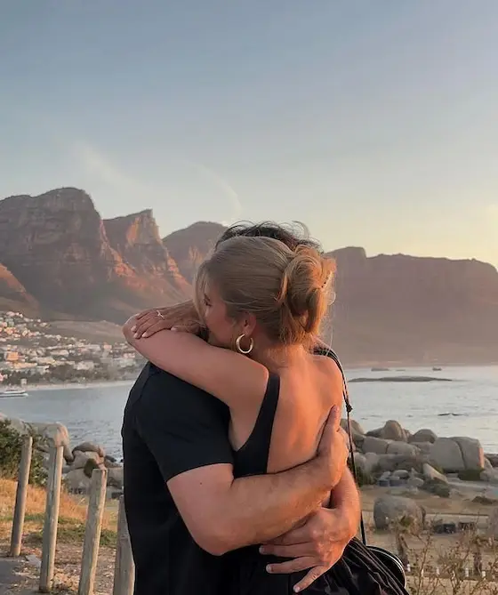 Couple embracing at sunset